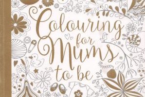 Cover of a pregnancy coloring book for mums to be showing gold and white intricate floral and baby motif illustrations with the title Colouring for Mums to Be.
