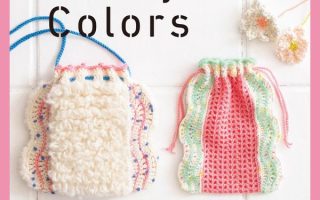 Cover of a Japanese crochet pattern book showing pastel pouches, a scrunchie and a boucle bag in candy shades.
