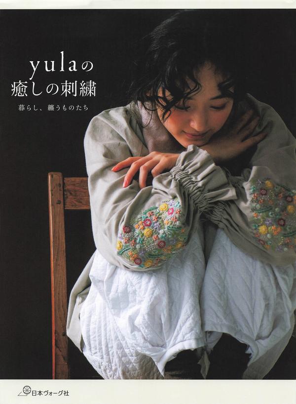 Cover of a Japanese embroidery pattern book by yula, showing a linen smock blouse with wildflower-embroidered sleeves.