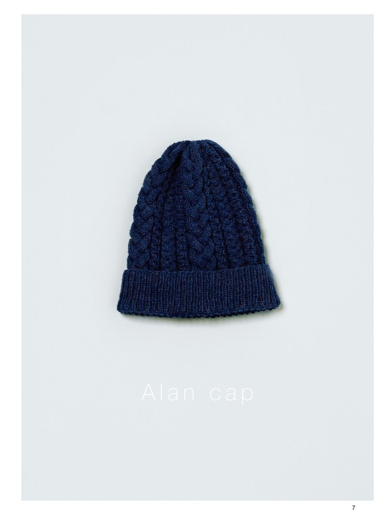1410-00009 Navy cable knit cap laid flat, a classic Aran hat pattern for beginners and experienced knitters