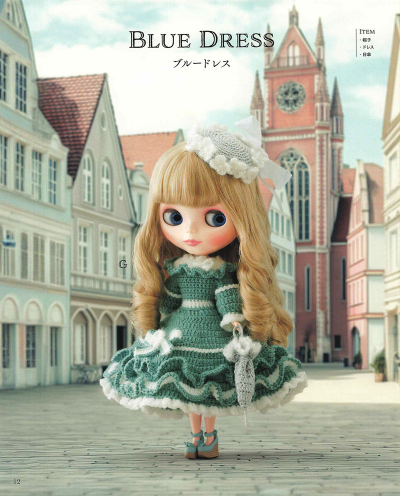 1492-04232026184101_014 Ruffled teal crochet dress with white trim, a flower hat and a tiny umbrella from this tiered skirt doll dress pattern