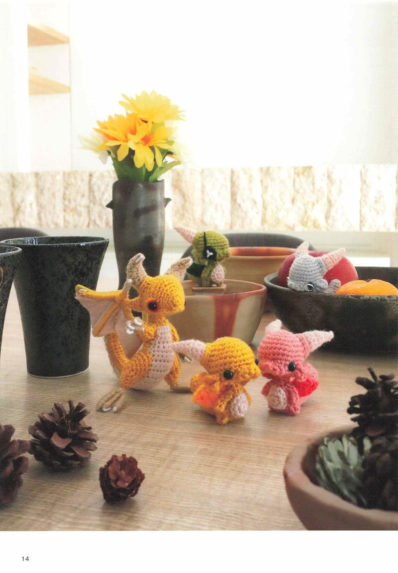 1495-04232026184535_017 Small crochet dragons on a table with flowers, pine cones and a ceramic vase