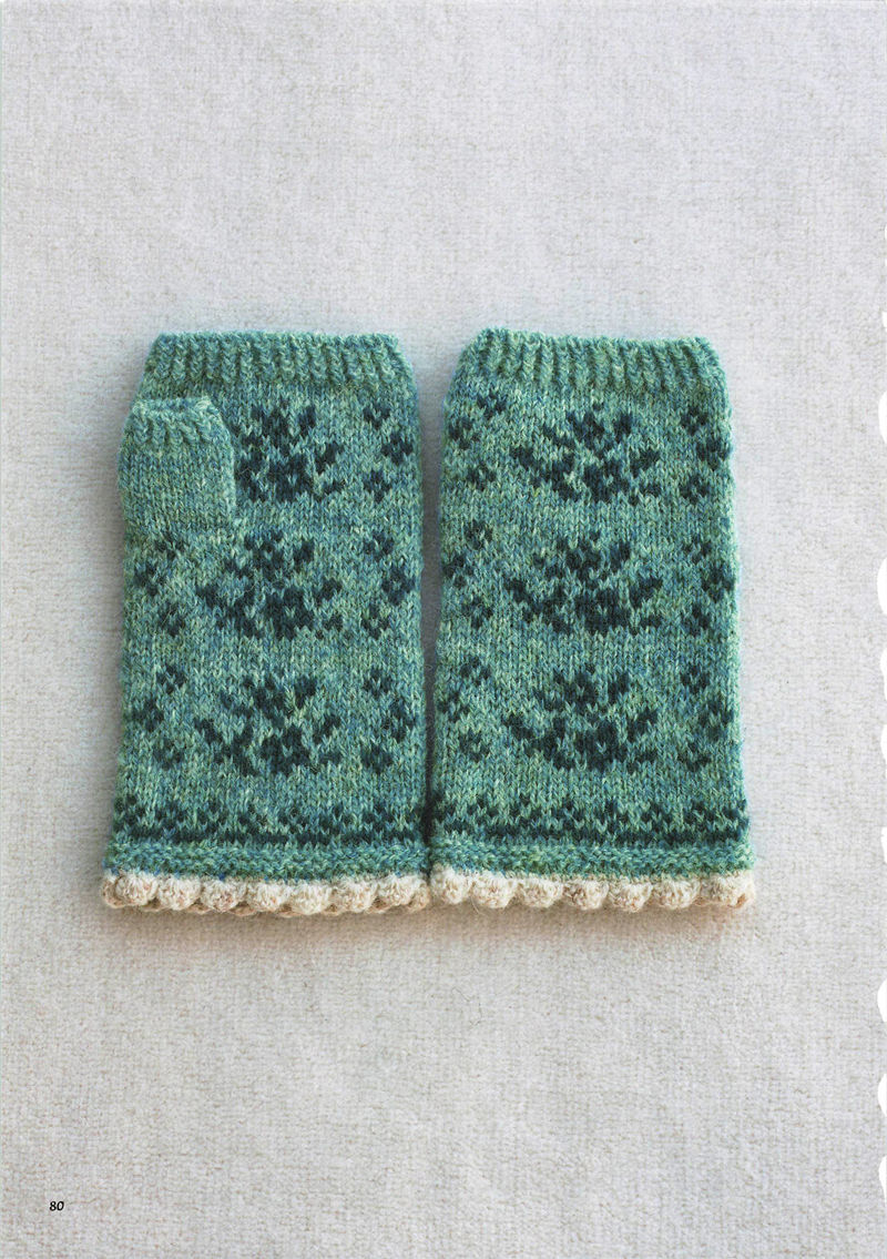 1496-20260309135601_081 Teal knit fingerless gloves with dark navy snowflake-like flowers and a cream scalloped cuff