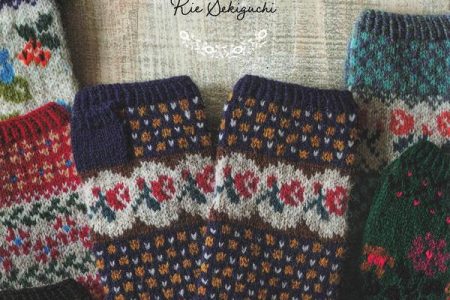 Cover of Fair Isle knitting patterns by Rie Sekiguchi with navy rose fingerless mitts and floral colorwork gloves
